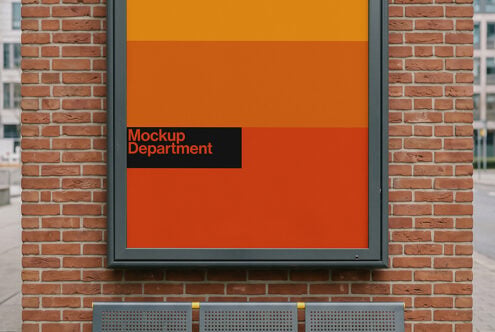 Orange storefront window display with Mockup Department branding on brick wall