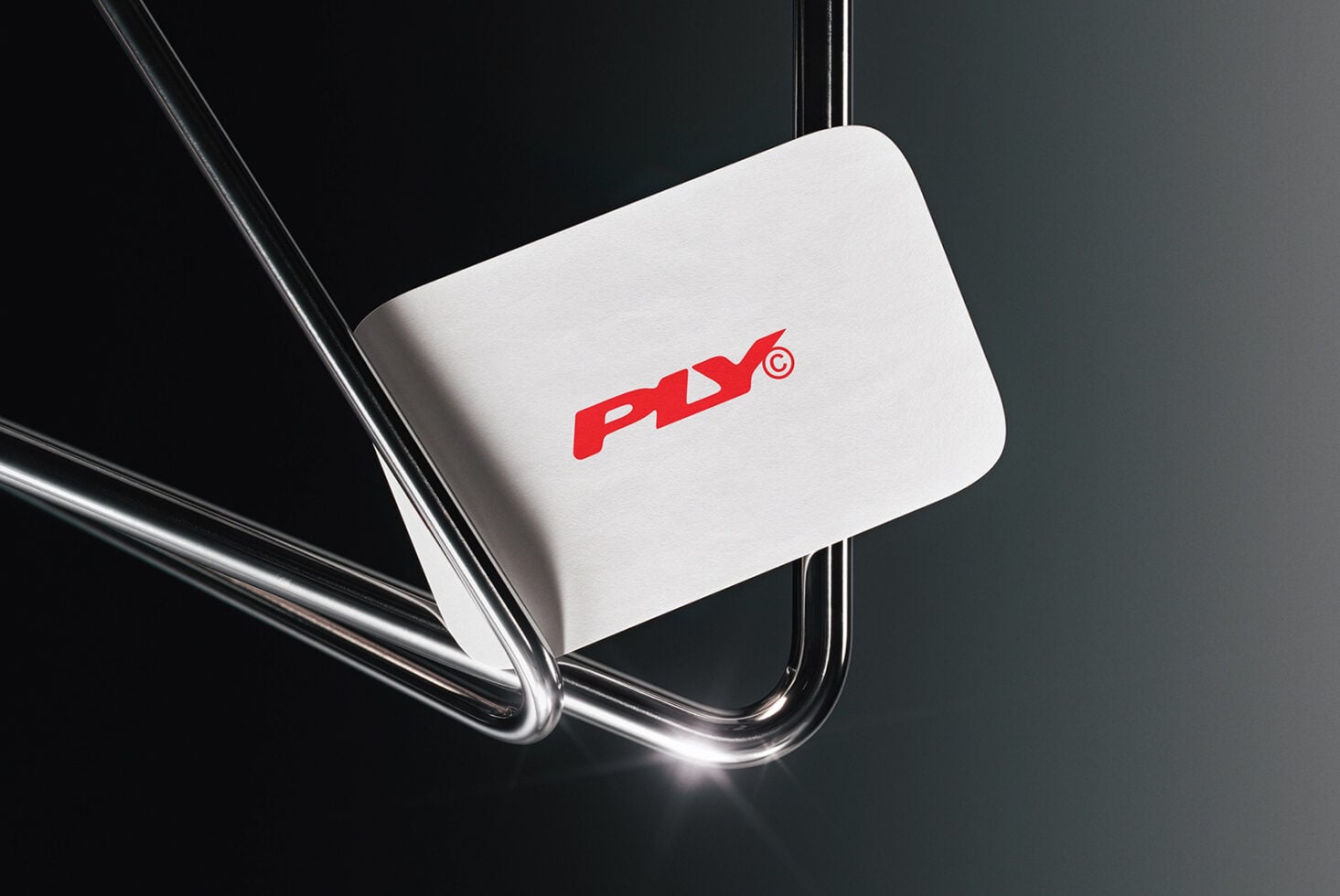 White rounded business card mockup with bold red logo hanging from clear acrylic strings