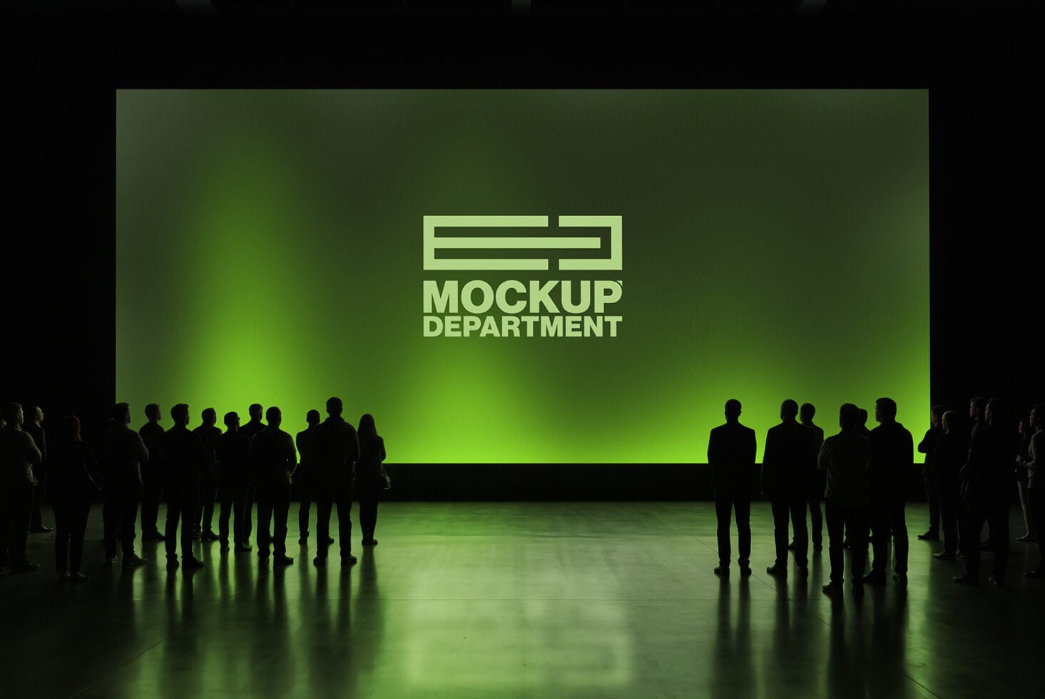 Silhouettes of people standing in front of glowing green screen with Mockup Department logo