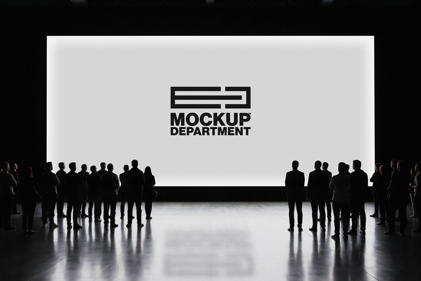 Silhouettes of people gathered in front of a large projection screen displaying Mockup Department logo