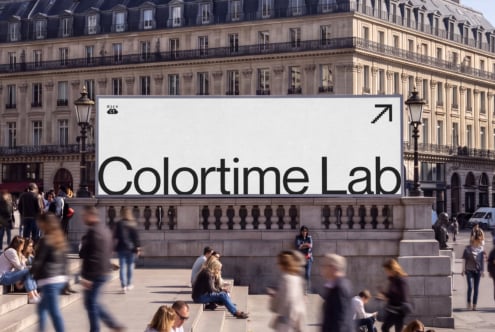 Large billboard mockup with Colortime Lab branding on Parisian building facade with street activity