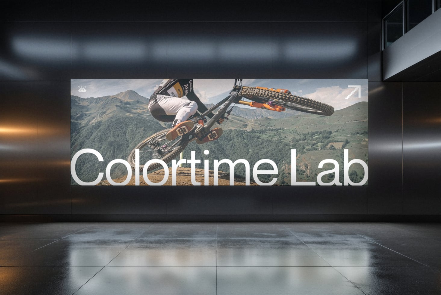 Billboard mockup with dirt bike rider mid-air over mountain landscape, Colortime Lab branding