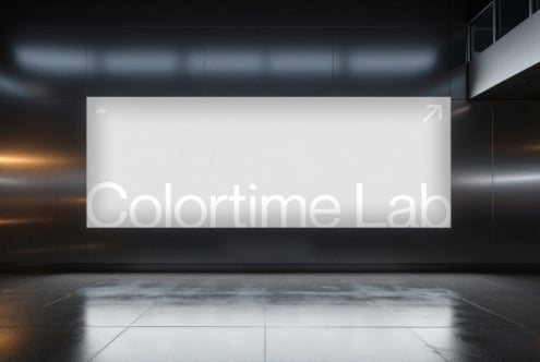 Colortime Lab sign glowing on modern gallery wall in sleek dark space