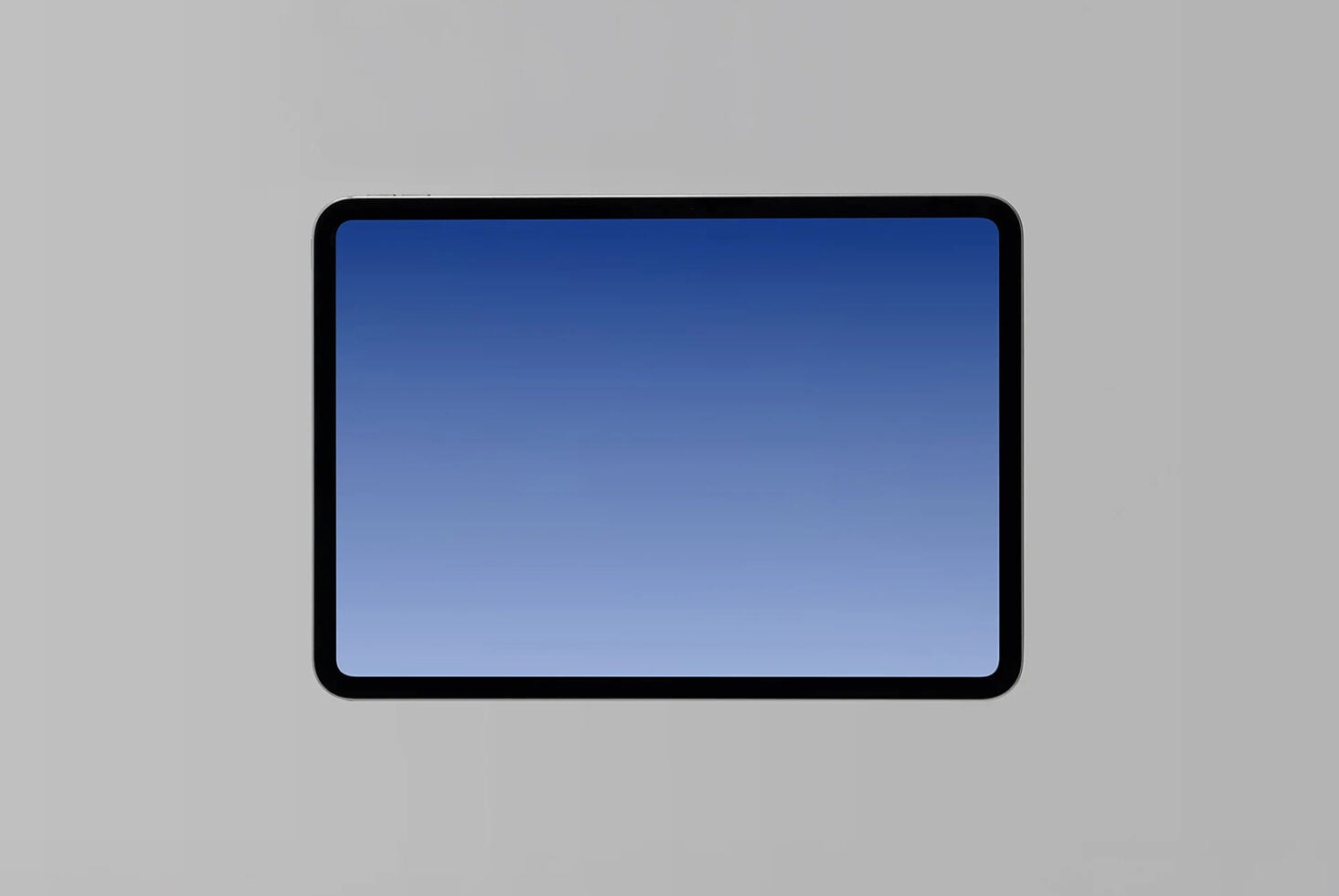 Black tablet device with rounded corners displaying blue gradient screen on gray background