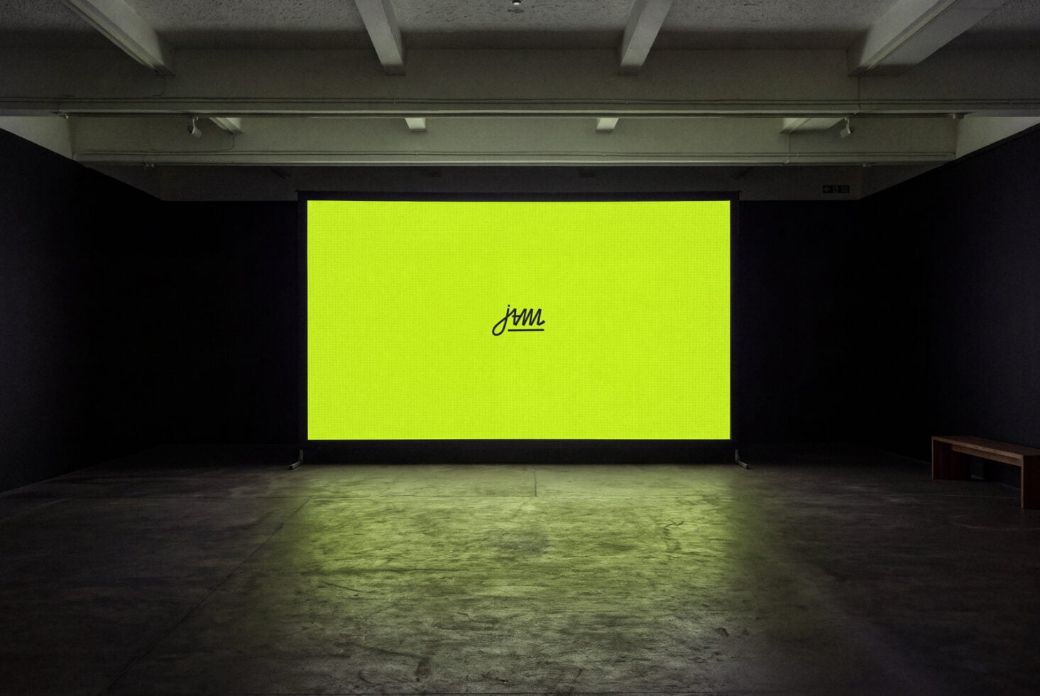 Neon yellow billboard mockup in industrial gallery space with concrete floor