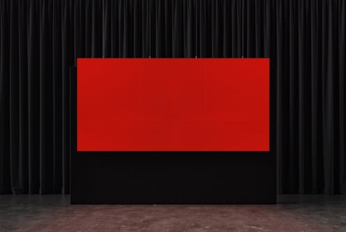 Red billboard mockup hanging on black velvet curtain stage backdrop