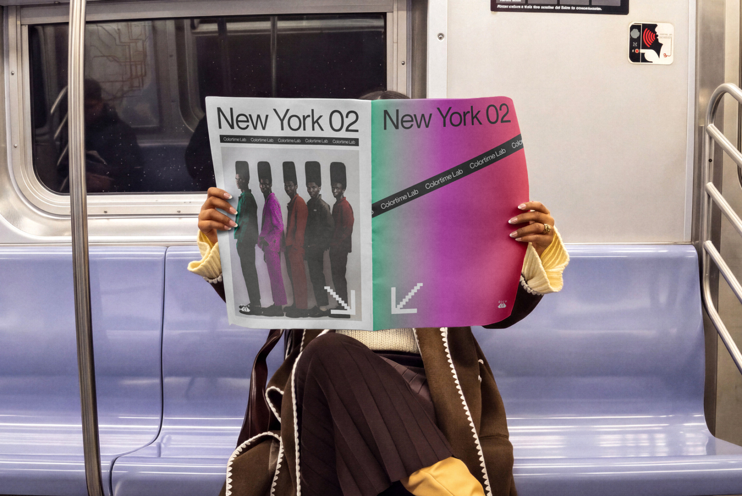 Person on subway holding two colorful magazine covers with gradient backgrounds, silhouettes, typography