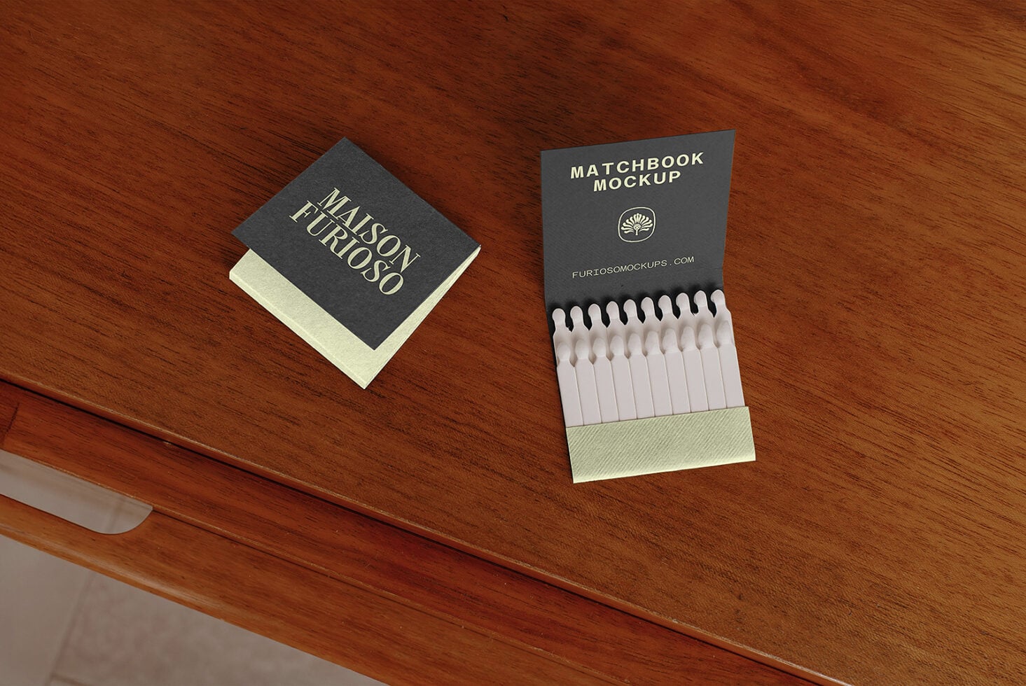 Matchbook mockup with cream matches displayed on wooden table surface next to branded book