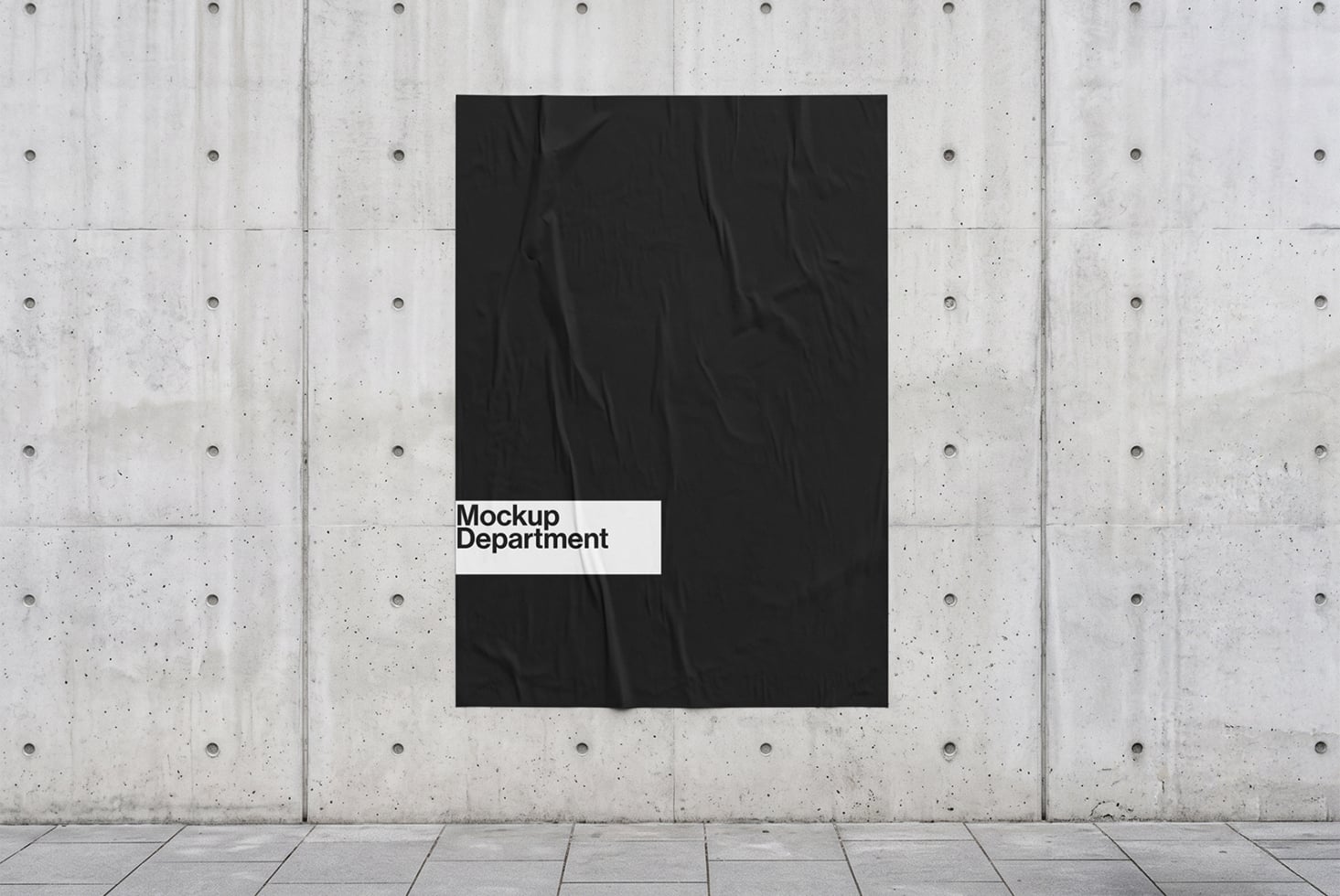 Black poster mockup on concrete wall with white label reading Mockup Department