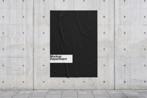 Black poster mockup on concrete wall with white label reading Mockup Department