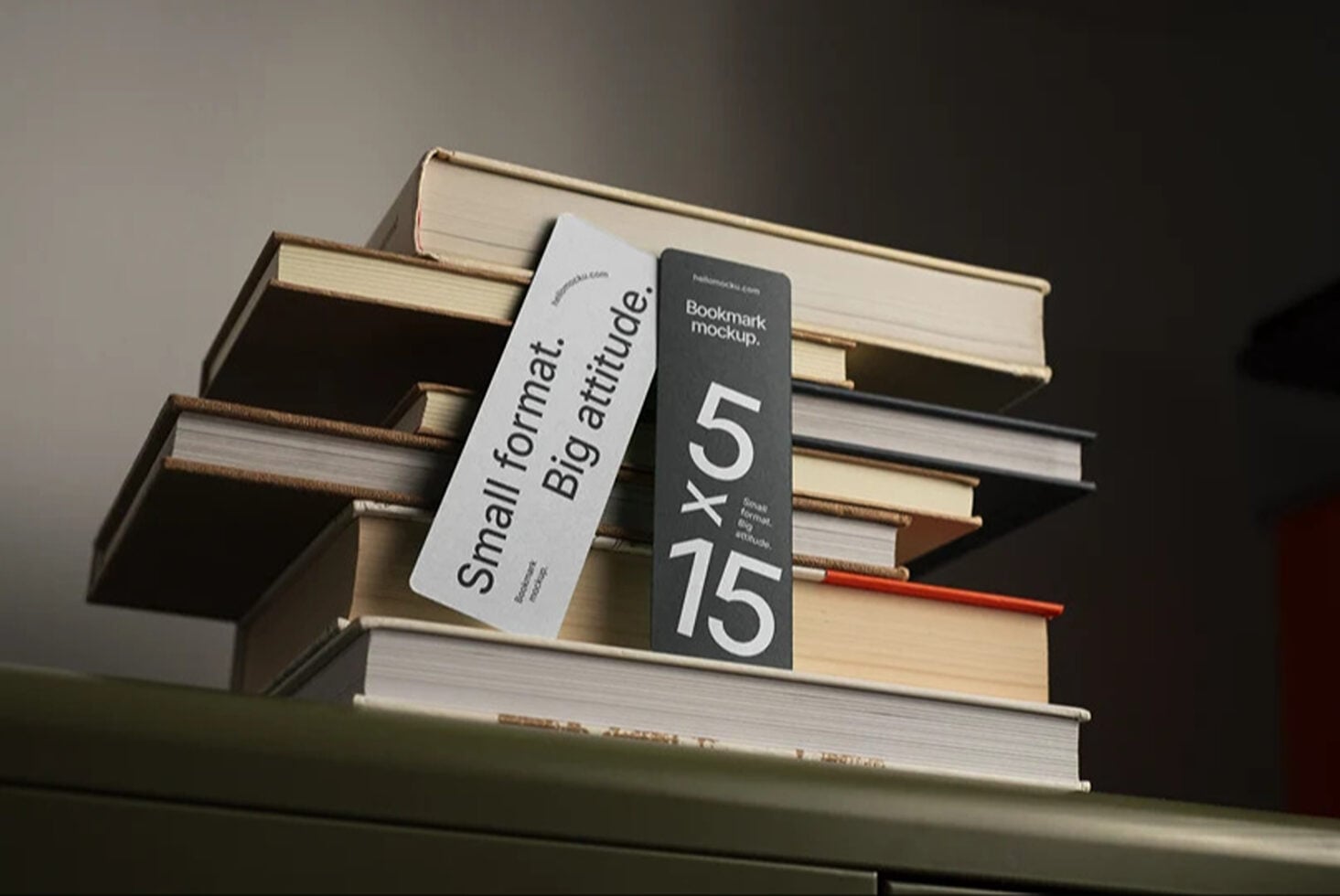Stacked books with white, black, plus red bookmark mockups leaning against spines
