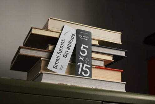Stacked books with white, black, plus red bookmark mockups leaning against spines