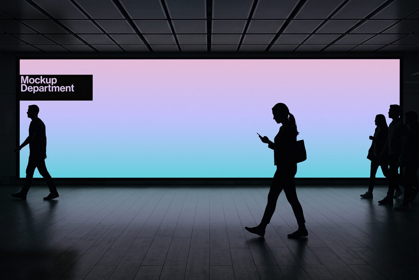Modern office lobby with silhouetted people walking past large pink-to-blue gradient billboard display