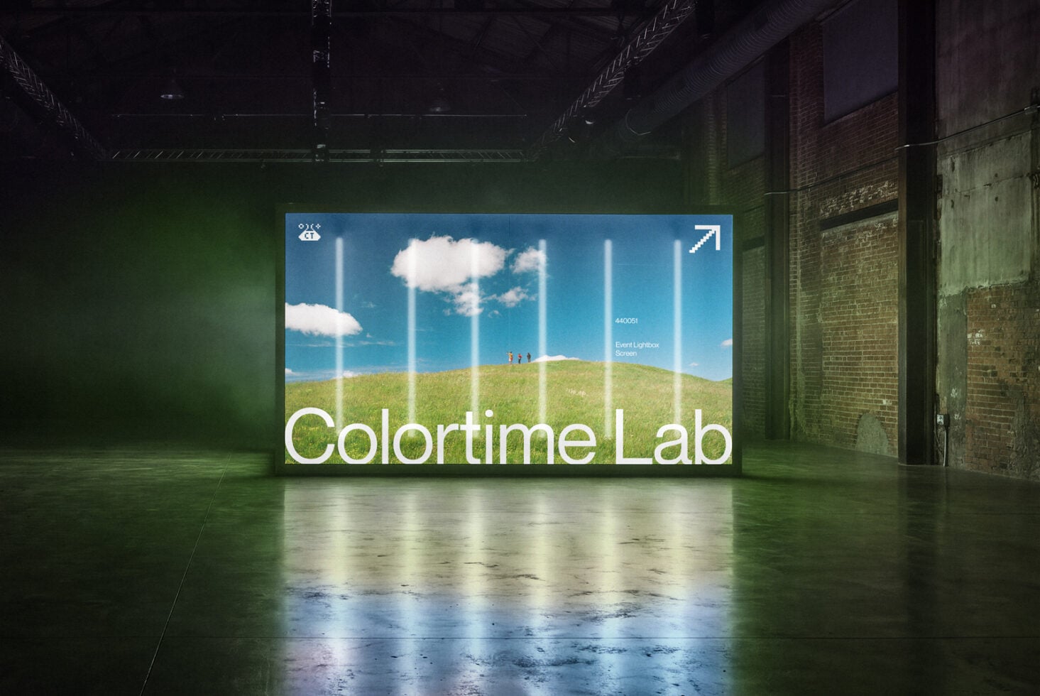 Neon lightbox screen mockup displaying Colortime Lab branding in industrial warehouse space