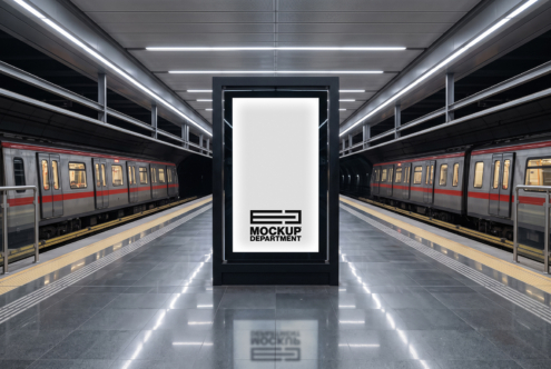 Vertical billboard mockup centered on subway platform between two trains with bright overhead lighting