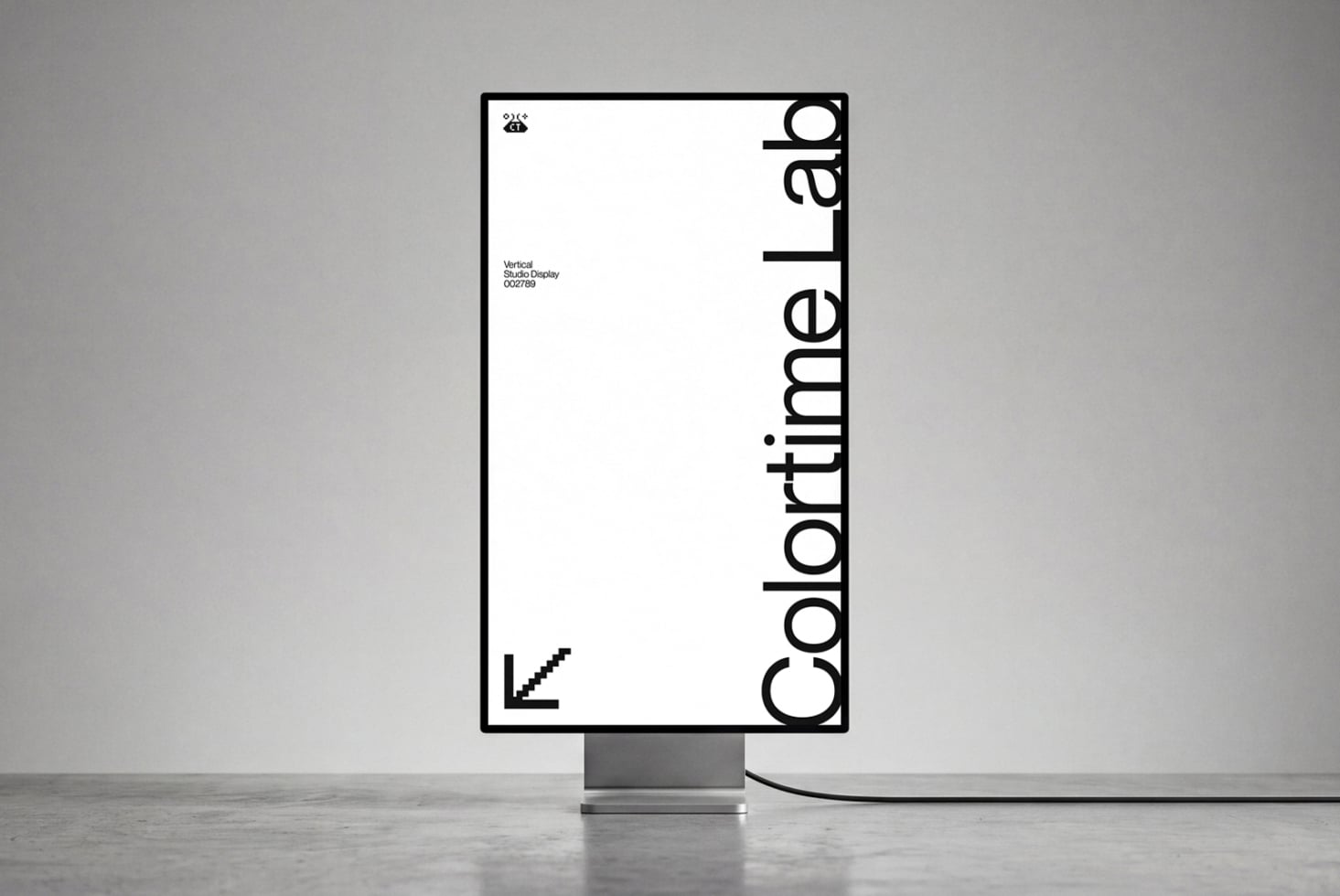 Vertical studio display mockup showing minimal branding layout with bold typography on screen