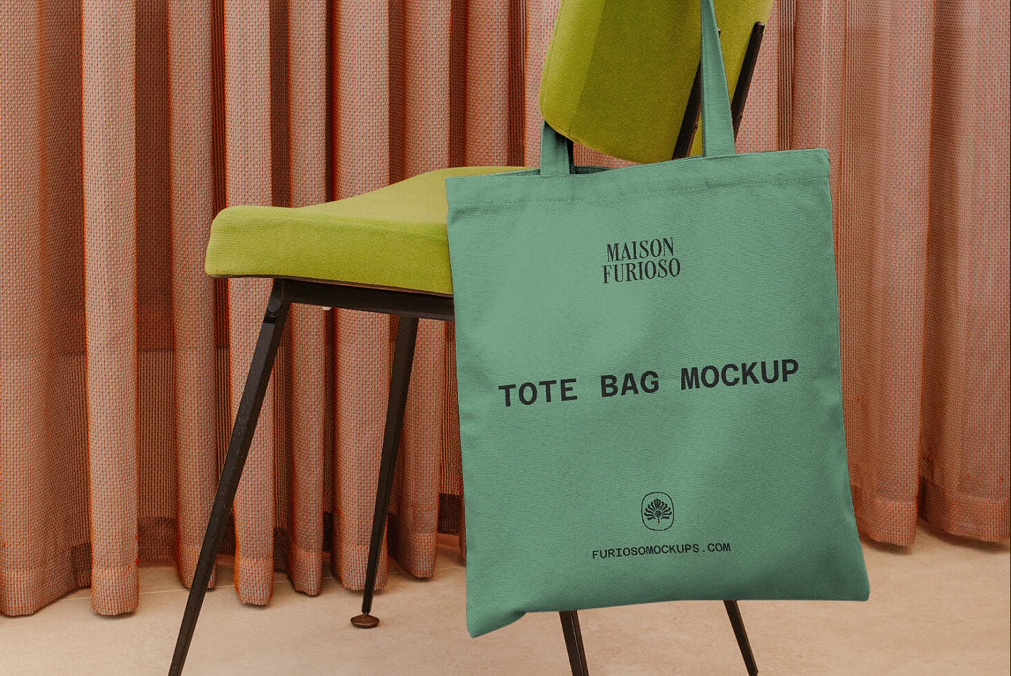 Sage green tote bag draped over mid-century chair with chartreuse cushion, terracotta curtains behind