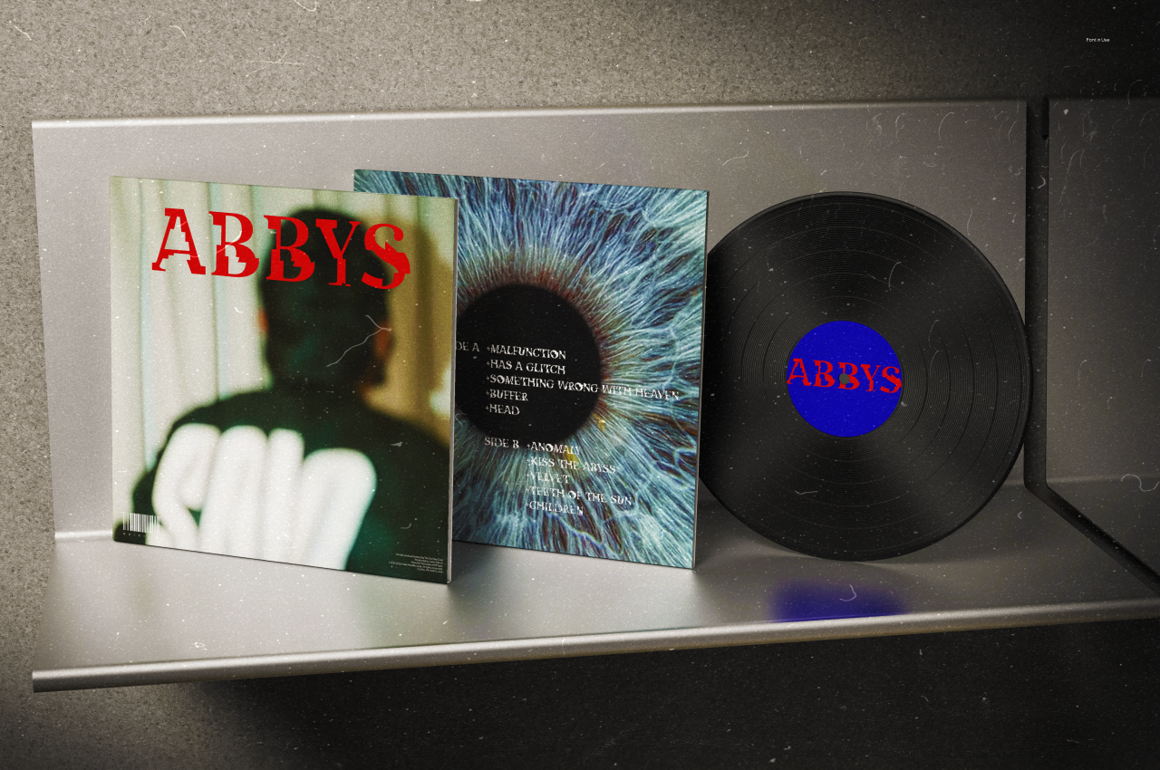 Vinyl record mockup with gatefold album art showing moody photography, eye close-up, bold red typography on black vinyl
