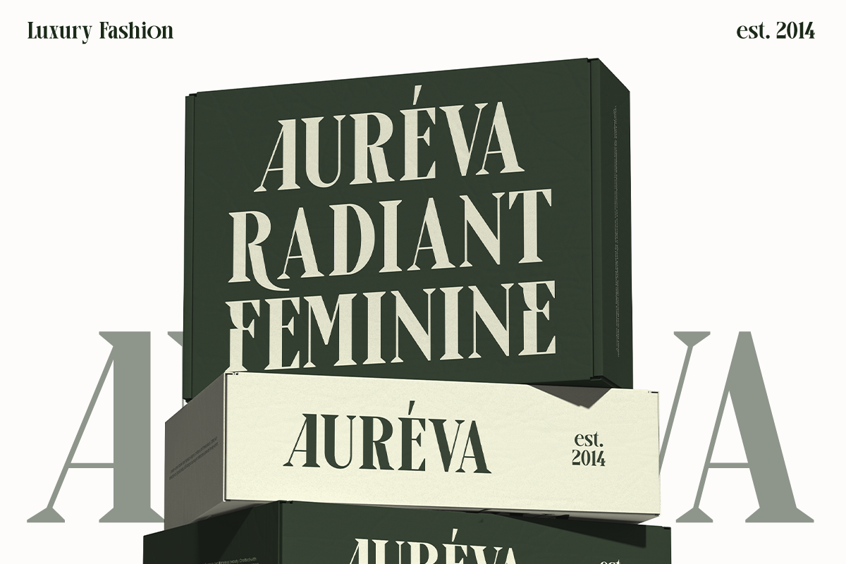 Stacked luxury fashion boxes in deep green with cream serif typography for Aureva brand mockup