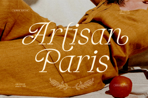 Elegant serif font displayed over warm ochre fabric with decorative flourishes