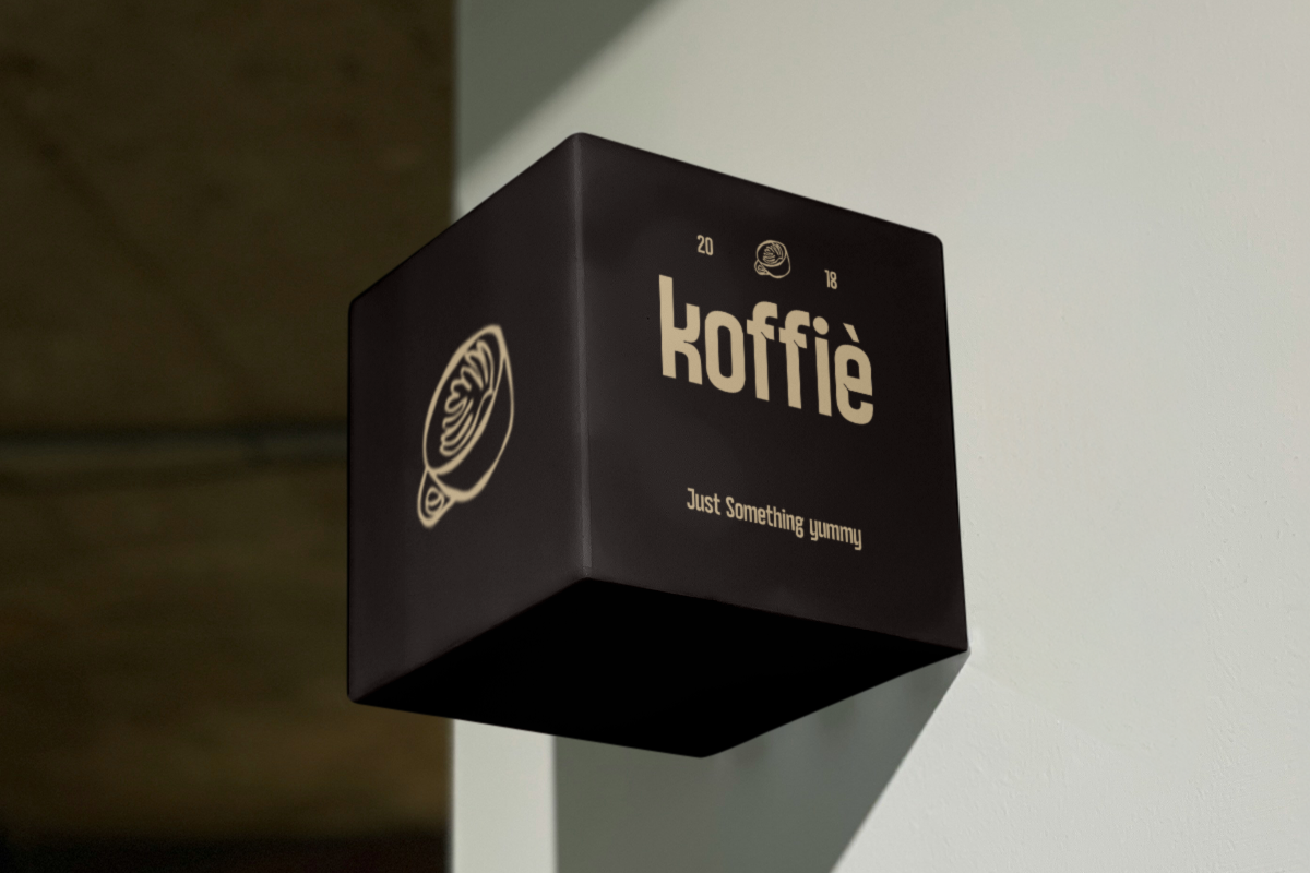 Black box mockup for koffie brand with cream logo, tagline, gold foil details