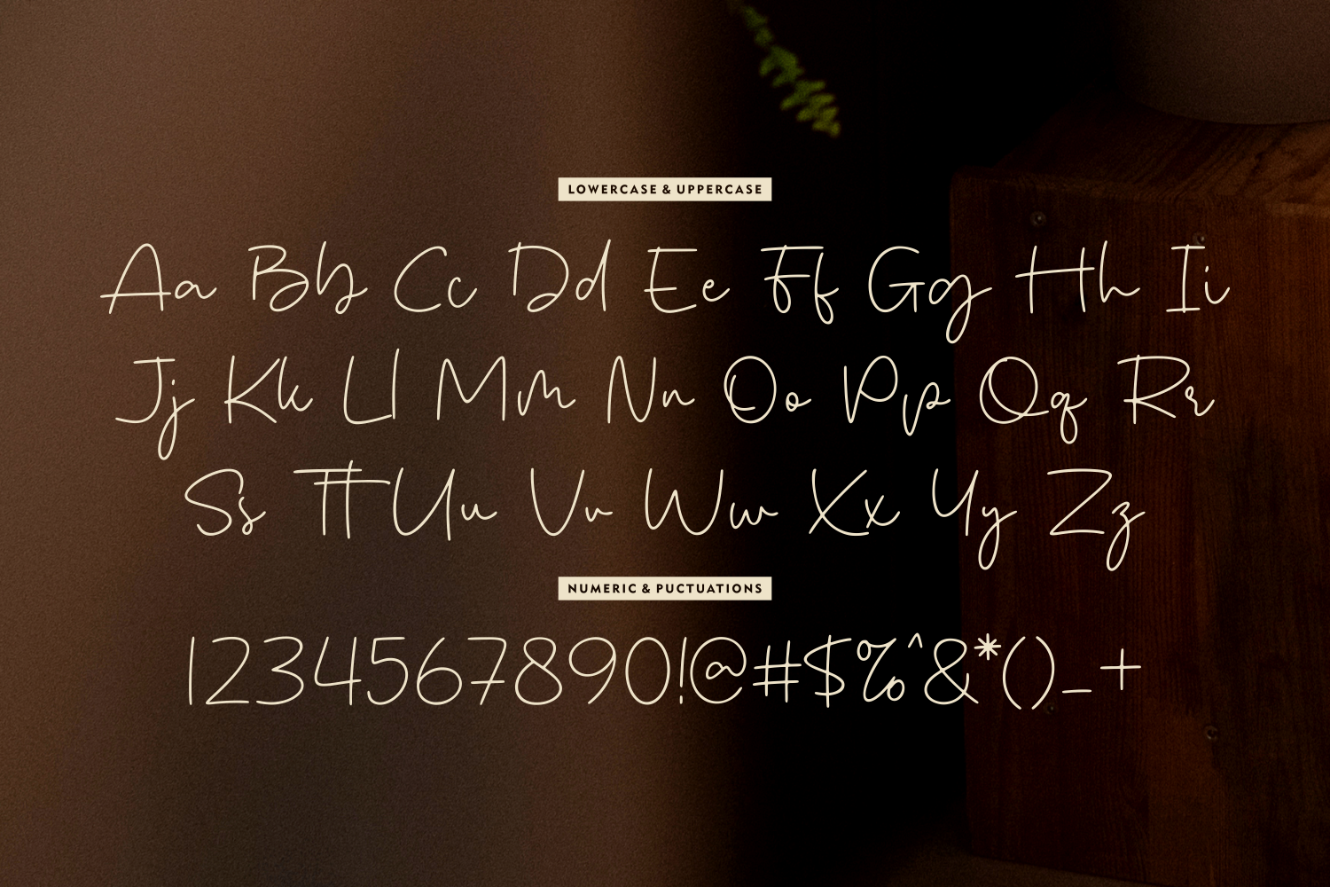 Handwritten script font with full character set displayed on warm brown textured background