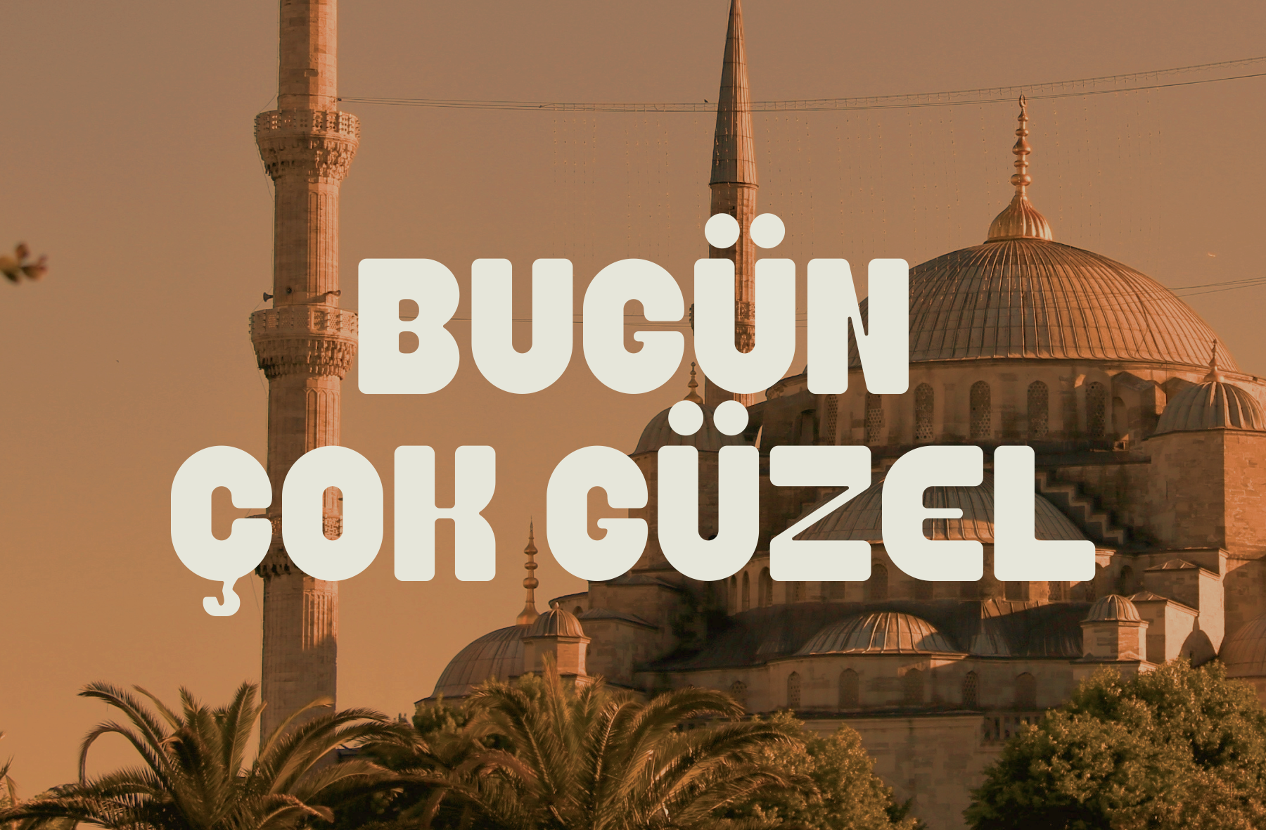 Bugun Cok Guzel bold sans serif font overlaid on Istanbul mosque architecture at golden hour