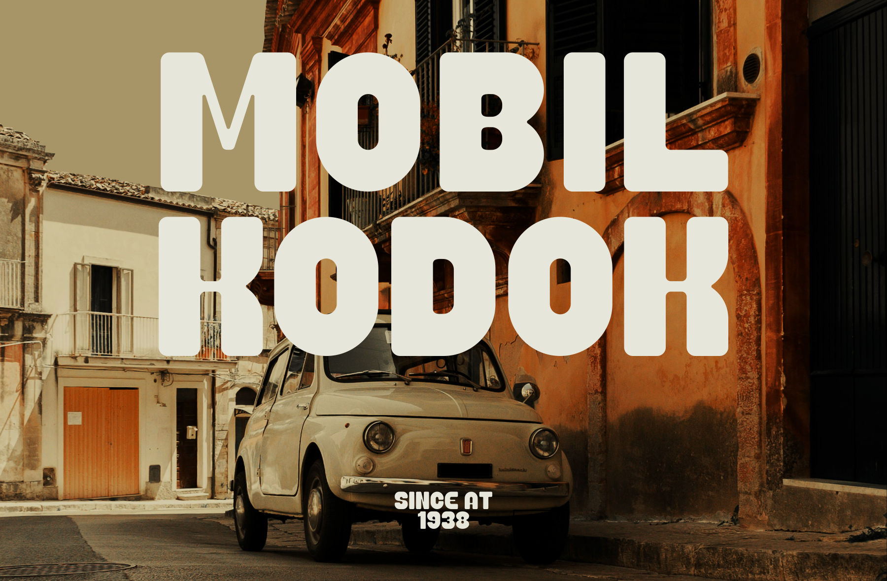 Vintage Fiat 500 parked on weathered Italian street with bold typography overlay