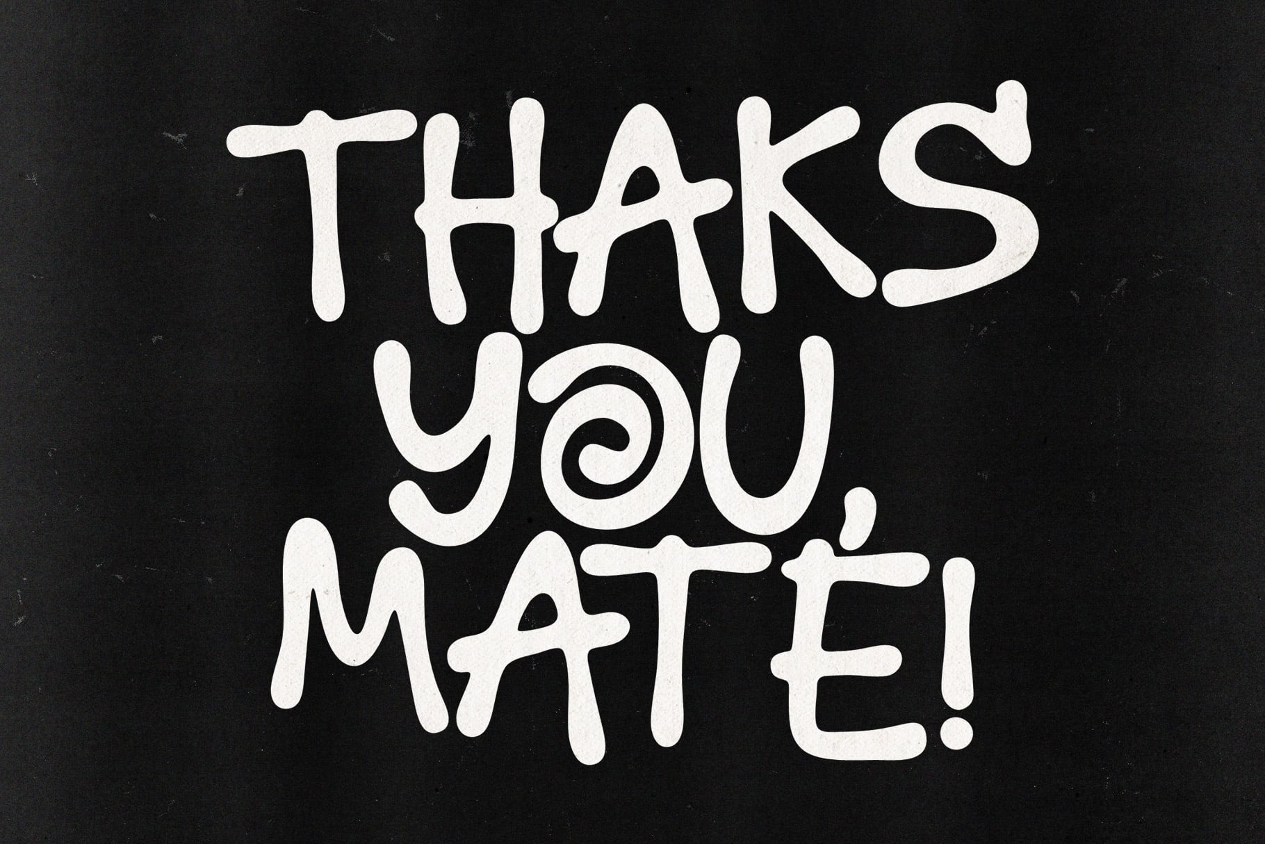 Hand-drawn white lettering spelling "Thanks You Mate" on textured black background