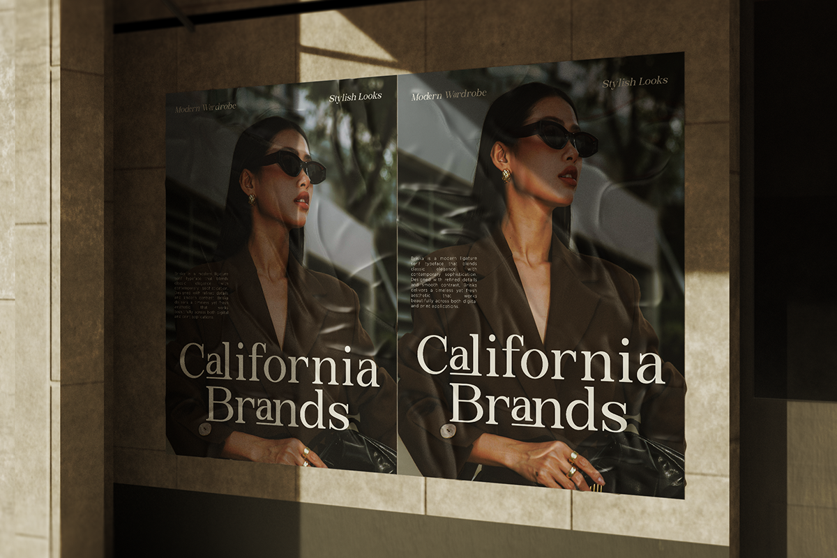 Two posters mounted on concrete wall featuring woman in sunglasses with California Brands text overlay