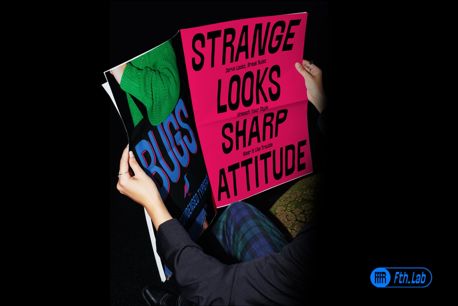 Person holding bold neon pink, black, blue magazine mockup with motivational text layout