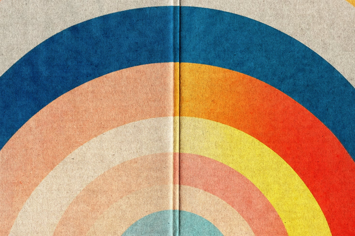 Colorful rainbow arcs on textured paper with a center fold creating symmetrical halves