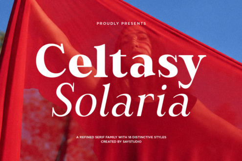Celtasy Solaria serif font family displayed on bold red fabric against blue sky