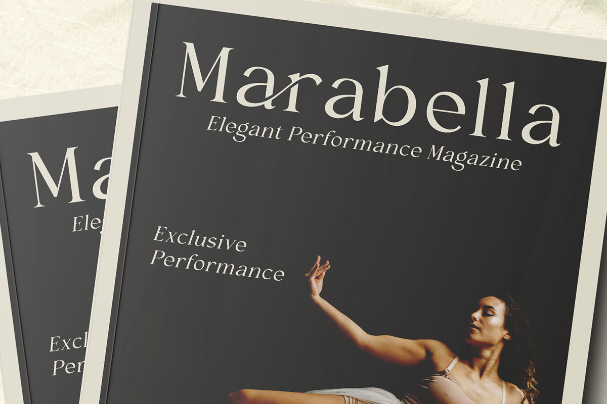 Marabella magazine mockup with dark cover, serif typography, dancer reaching upward