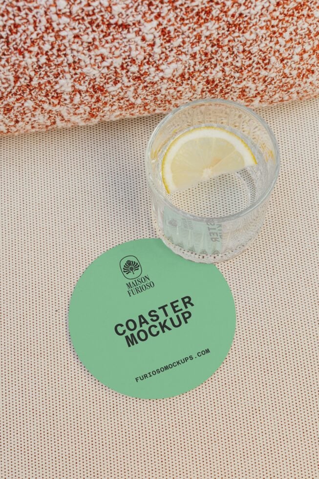 Mint coaster mockup styled with lemon water on textured background
