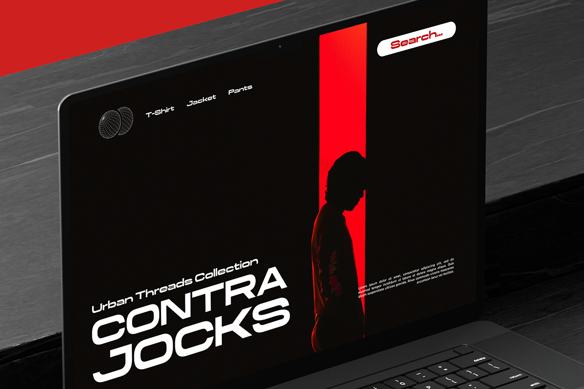 Laptop displaying edgy Urban Threads Collection website with bold red, black, silhouette model against dark background