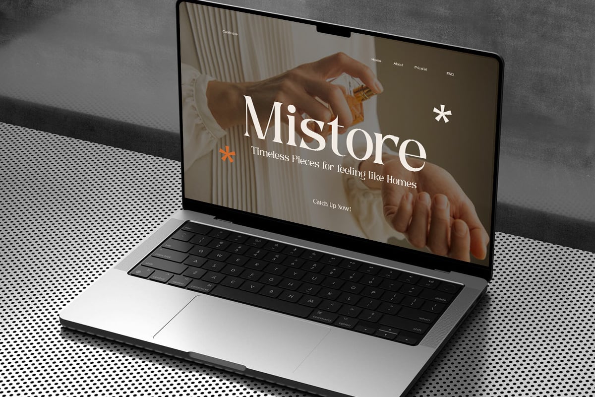 Laptop mockup displaying Mistore home goods website with warm minimalist design, hands holding ceramic vessel