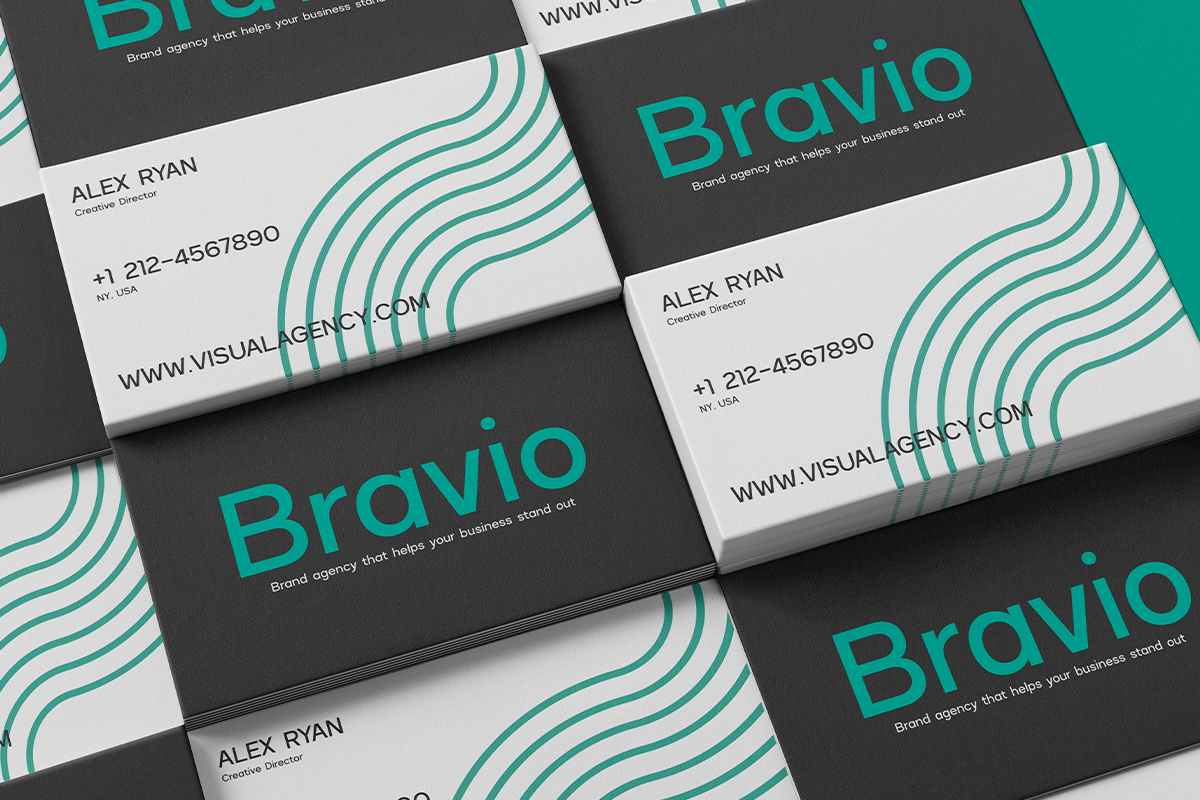 Business cards for Bravvio brand agency with teal wavy lines on dark grey plus white sides