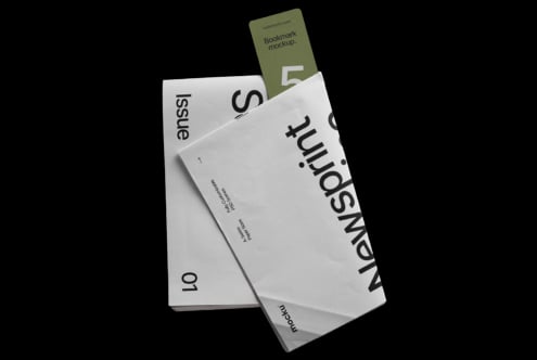 Stacked white envelopes with bold typography overlaid, olive green bookmark peeking out from top
