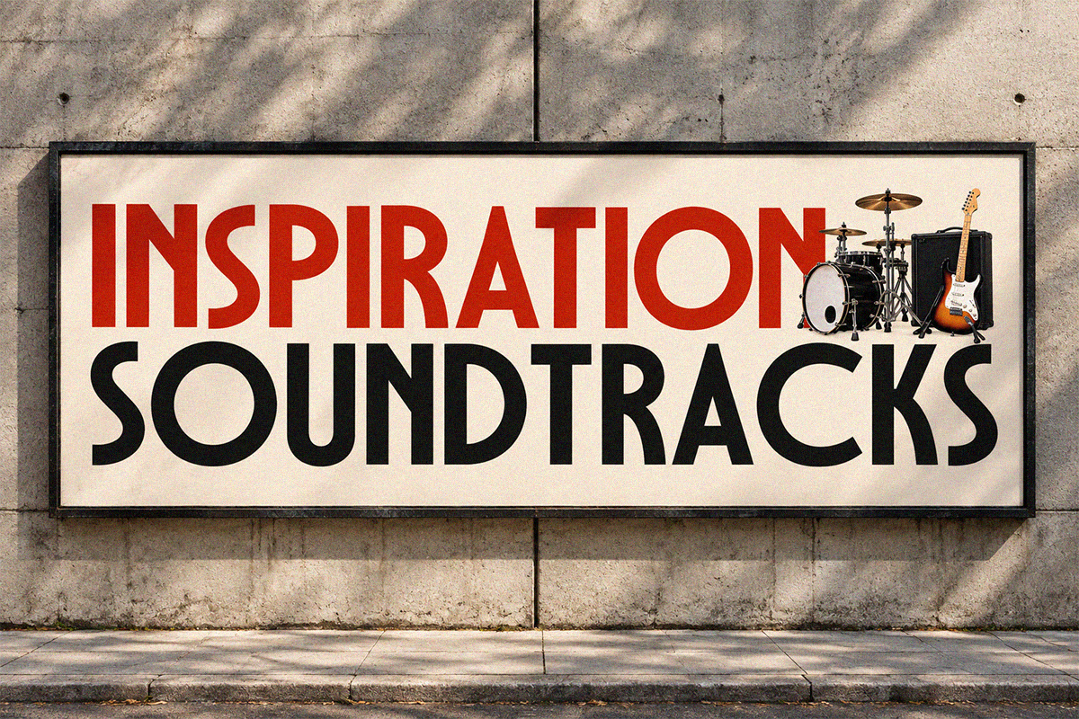 Vintage storefront sign with red "INSPIRATION" text, black "SOUNDTRACKS" below, drum kit graphic on concrete wall
