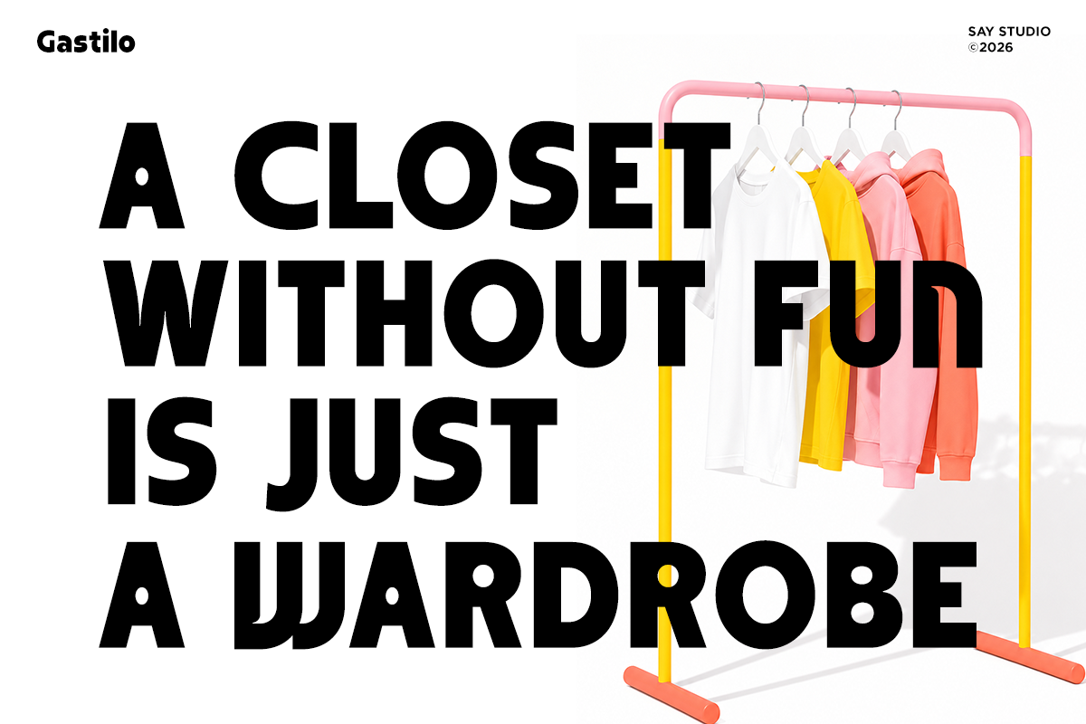 Minimalist clothing rack with colorful hangers, white, yellow, pink, coral shirts on pink metal frame with yellow accents