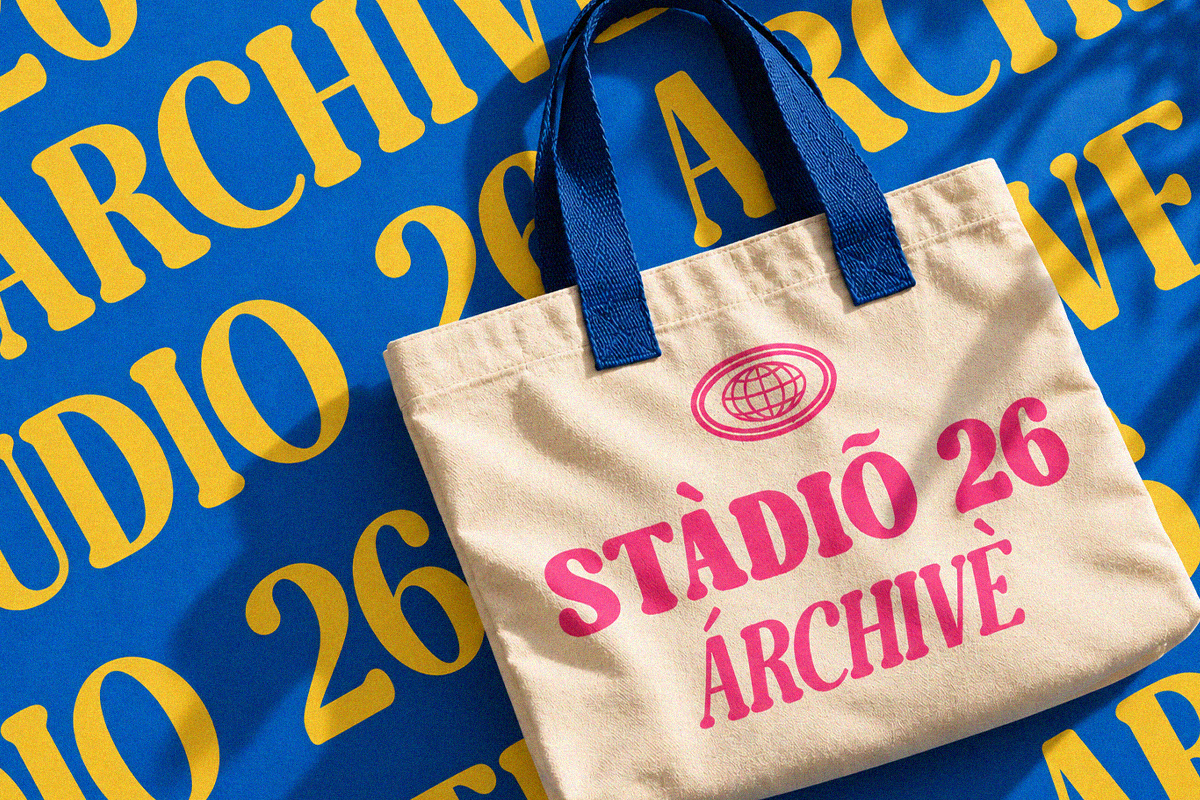 Cream canvas tote with hot pink "Studio Archive" text on bright blue background with yellow typography