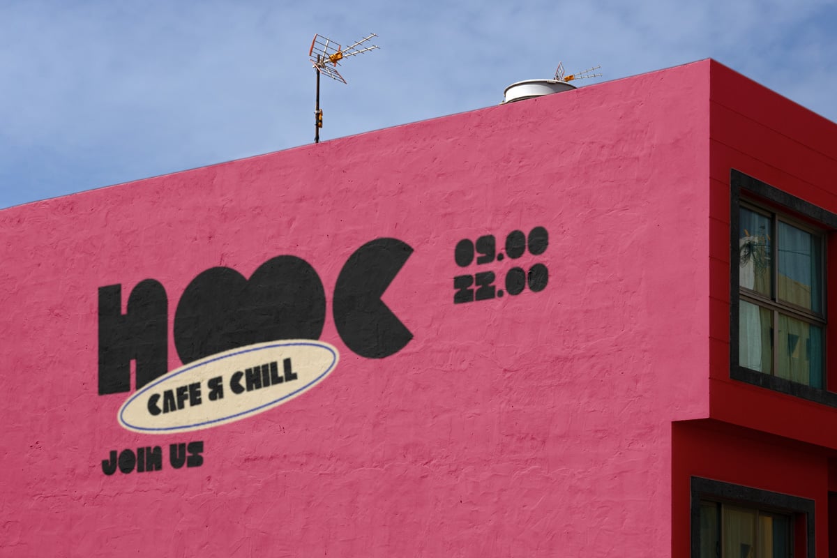 Retro pink building facade with bold "HOC Cafe & Chill" sign, vintage antenna on roof