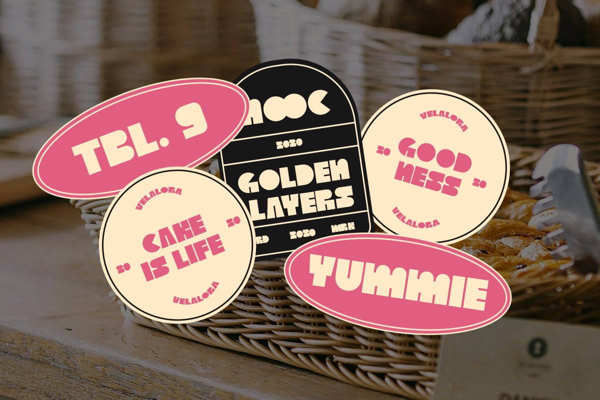 Retro sticker mockup with pink, black, cream labels in woven basket on wooden surface