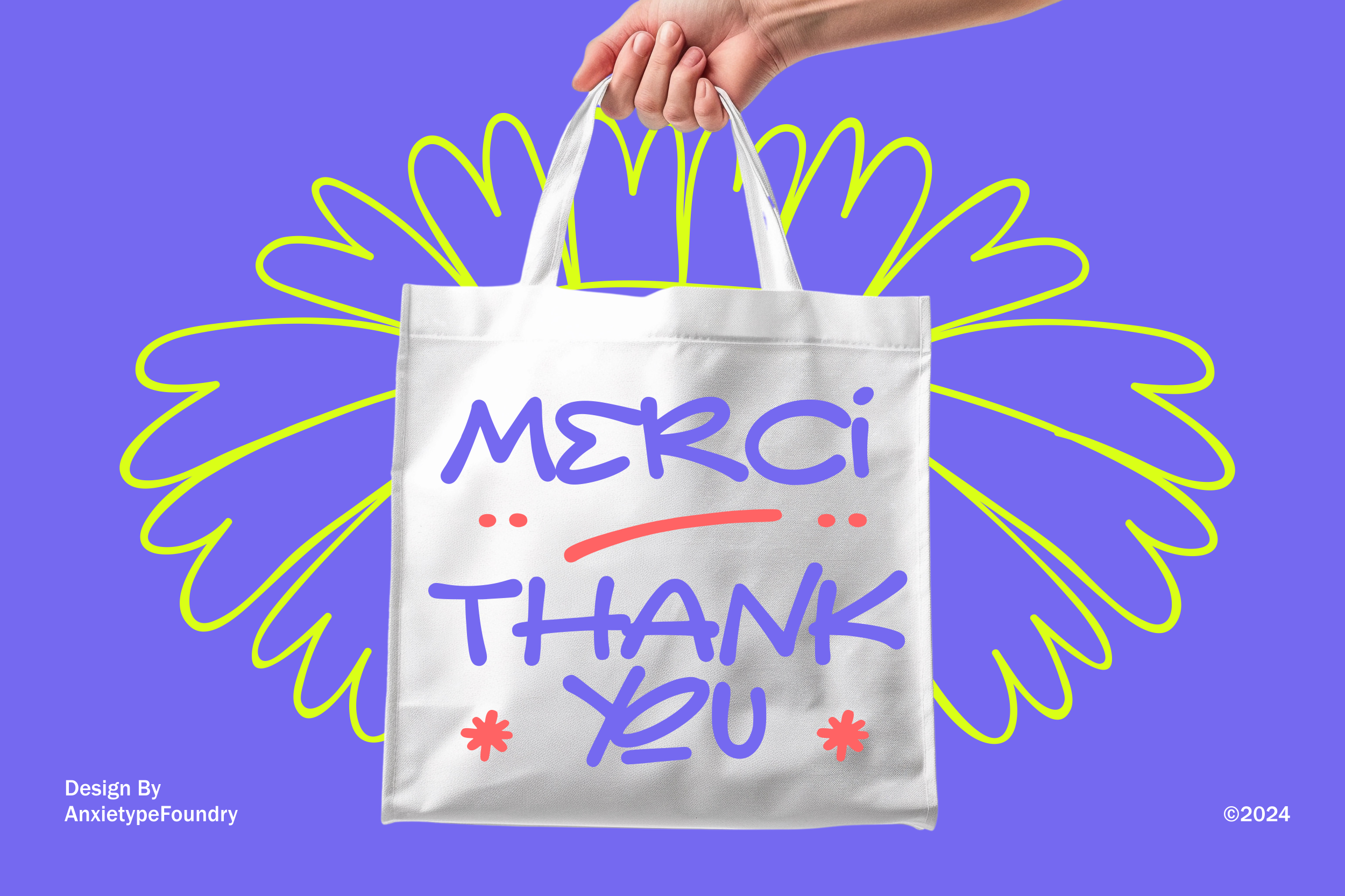 Hand holding white tote bag with "Merci Thank You" handwritten text on purple background