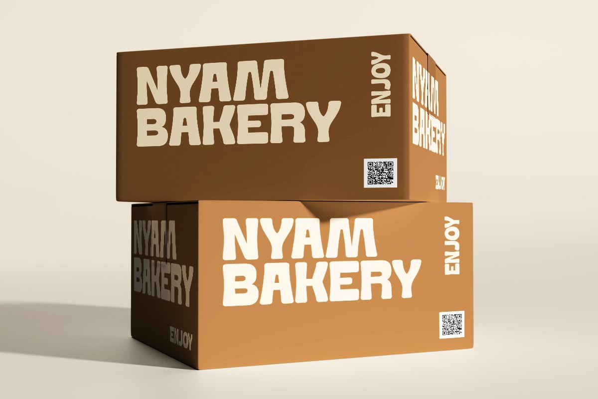 Stacked bakery boxes mockup in brown tones with QR codes on sides