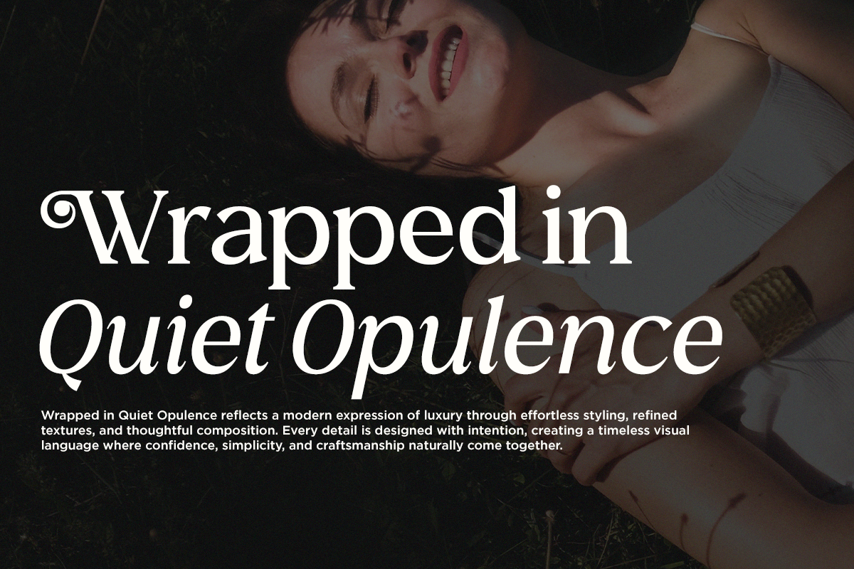 Moody overhead shot of woman on fabric with serif typography overlay