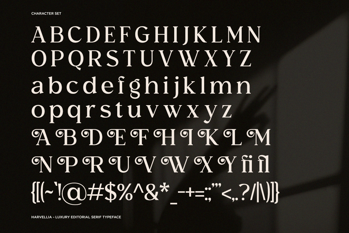 Harvellia serif typeface showing uppercase, lowercase, decorative swashes, plus numbers, symbols on dark background