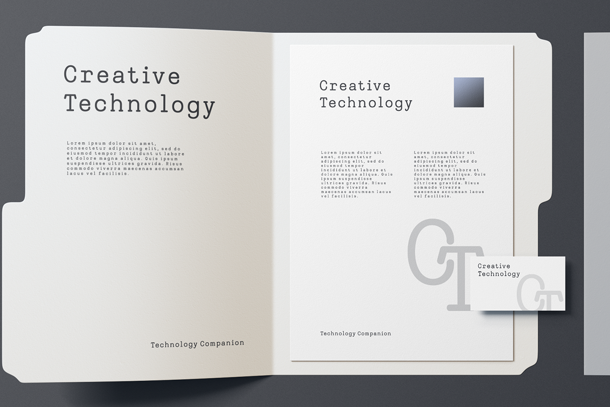 Branding mockup showing open book spread, business card, with monospace type layout for Creative Technology identity system