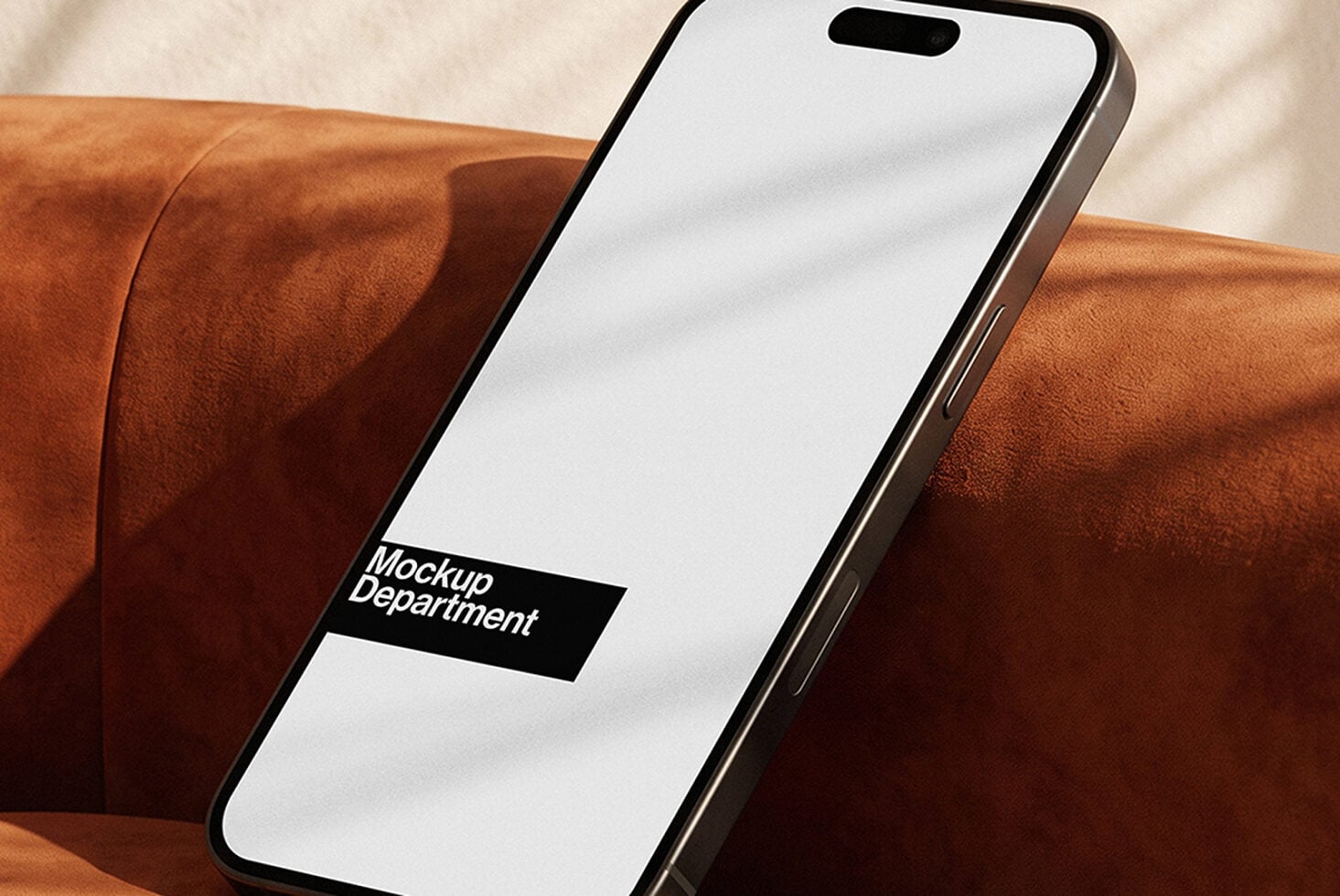 iPhone mockup on cognac leather with clean screen space for designs
